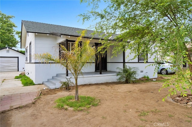 1559 N Carruth Ave, Fresno, CA 93728 - view of front of home featuring an outdoor structure, a garage, roof with shingles, and driveway