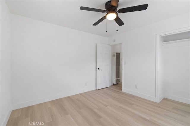 1559 N Carruth Ave, Fresno, CA 93728 - unfurnished bedroom with a ceiling fan, a heating unit, baseboards, and light wood-style floors