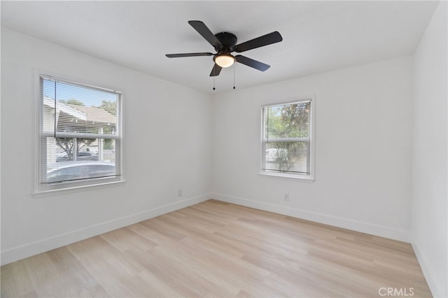 1559 N Carruth Ave, Fresno, CA 93728 - unfurnished room with baseboards, ceiling fan, and light wood-style flooring