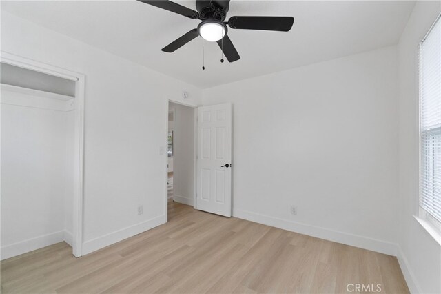 1559 N Carruth Ave, Fresno, CA 93728 - unfurnished bedroom with baseboards, ceiling fan, and light wood-type flooring