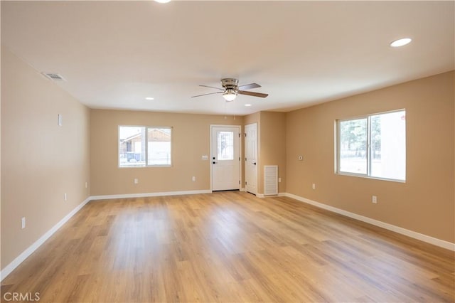 unfurnished room with ceiling fan, light wood-style flooring, baseboards, visible vents, and recessed lighting