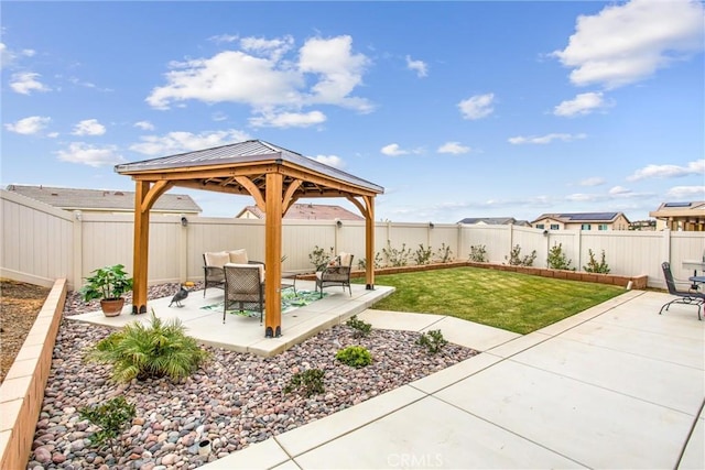view of yard with a gazebo, a patio area, and a fenced backyard
