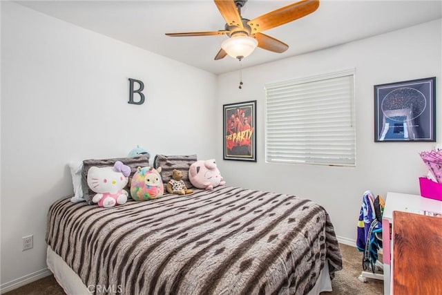carpeted bedroom with baseboards and ceiling fan