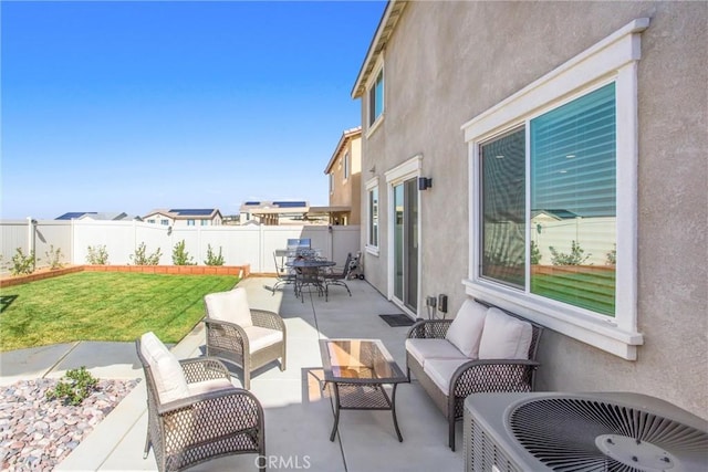 view of patio / terrace with a fenced backyard, outdoor lounge area, and outdoor dining space