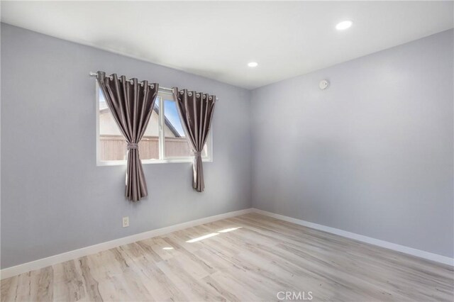 13261 Coast St, Garden Grove, CA 92844 - spare room with wood finished floors, baseboards, and recessed lighting
