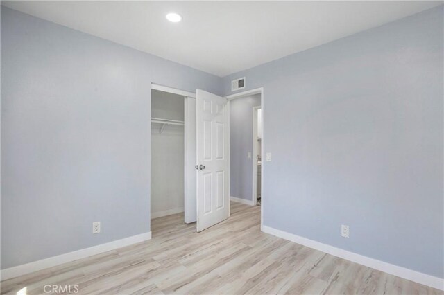 13261 Coast St, Garden Grove, CA 92844 - unfurnished bedroom with baseboards, wood finished floors, recessed lighting, and a closet