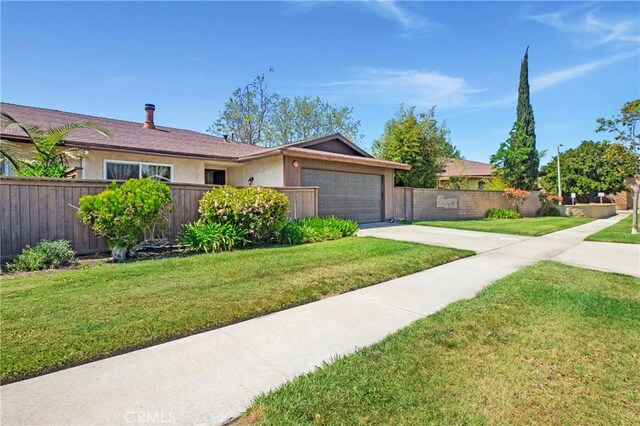 13261 Coast St, Garden Grove, CA 92844 - single story home with driveway, an attached garage, and stucco siding