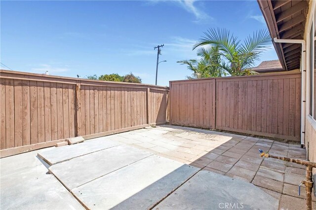 13261 Coast St, Garden Grove, CA 92844 - fenced backyard with a patio area