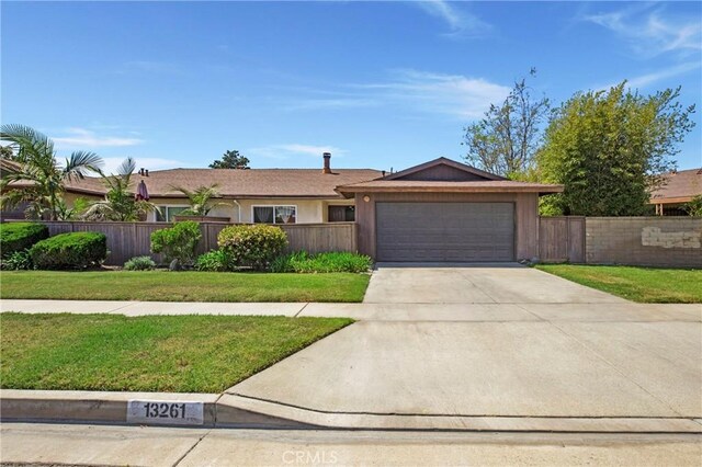13261 Coast St, Garden Grove, CA 92844 - single story home featuring a garage and concrete driveway