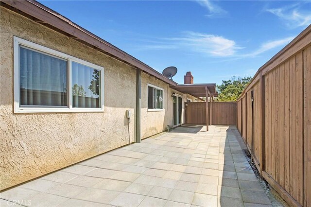 13261 Coast St, Garden Grove, CA 92844 - fenced backyard featuring a patio area
