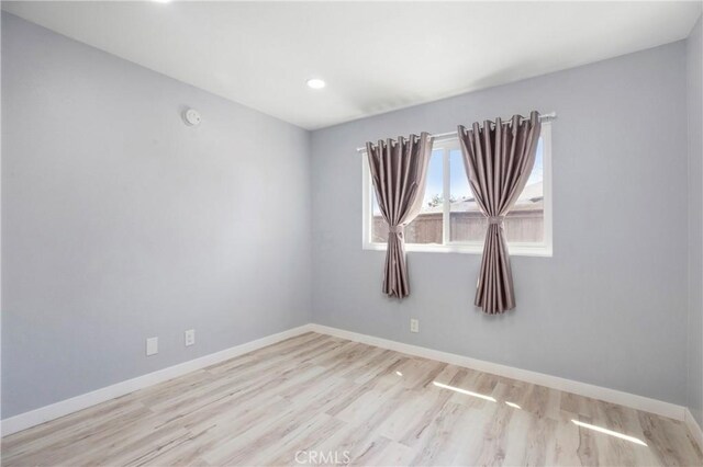13261 Coast St, Garden Grove, CA 92844 - empty room featuring wood finished floors, baseboards, recessed lighting, and a smoke detector
