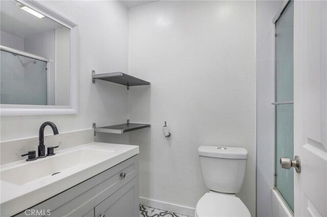 13261 Coast St, Garden Grove, CA 92844 - full bathroom featuring vanity, toilet, baseboards, and enclosed tub / shower combo
