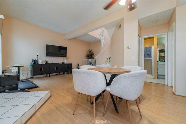 dining area featuring a ceiling fan, wood finished floors, and visible vents