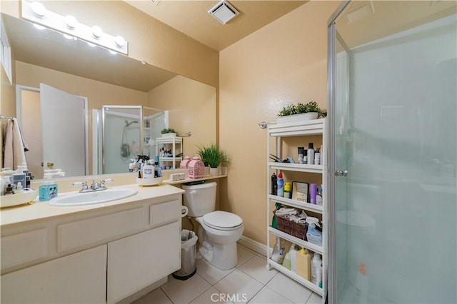 full bathroom with a stall shower, vanity, toilet, tile patterned flooring, and visible vents