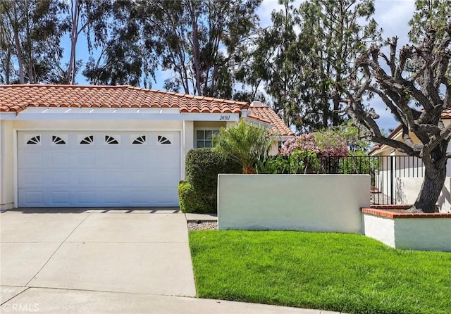 view of front facade with fence, stucco siding, concrete driveway, a tile roof, and a garage