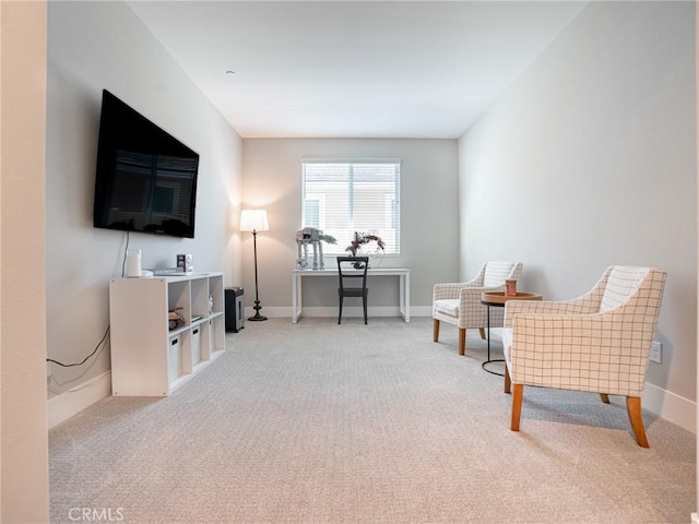 living area with carpet floors and baseboards