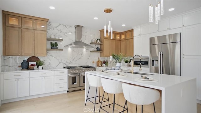 44 Statehouse Pl, Irvine, CA 92602 - kitchen with light countertops, open shelves, stainless steel appliances, and wall chimney exhaust hood