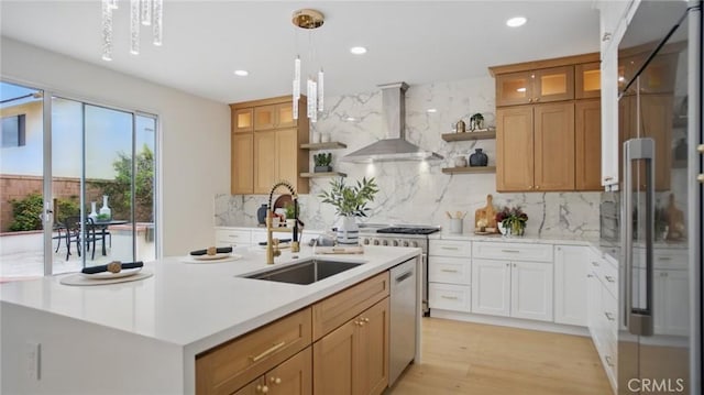 44 Statehouse Pl, Irvine, CA 92602 - kitchen featuring wall chimney range hood, stainless steel dishwasher, open shelves, high quality fridge, and a sink