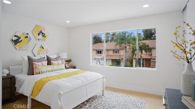 44 Statehouse Pl, Irvine, CA 92602 - bedroom featuring baseboards, recessed lighting, and wood finished floors