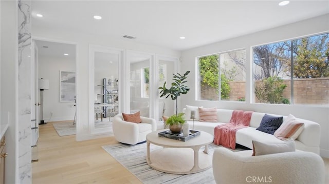 44 Statehouse Pl, Irvine, CA 92602 - living area featuring recessed lighting, light wood-type flooring, and visible vents