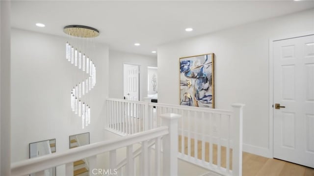 44 Statehouse Pl, Irvine, CA 92602 - hallway featuring recessed lighting, light wood-type flooring, and an upstairs landing