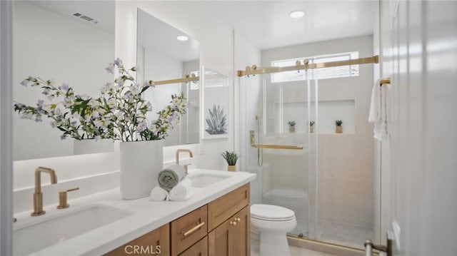 44 Statehouse Pl, Irvine, CA 92602 - bathroom with a sink, a stall shower, toilet, and double vanity