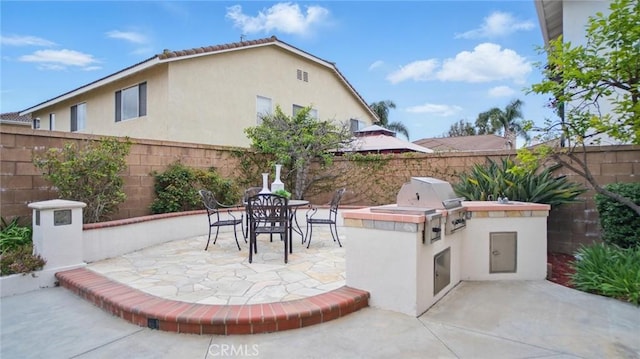 44 Statehouse Pl, Irvine, CA 92602 - view of patio / terrace with grilling area, exterior kitchen, outdoor dining area, and a fenced backyard