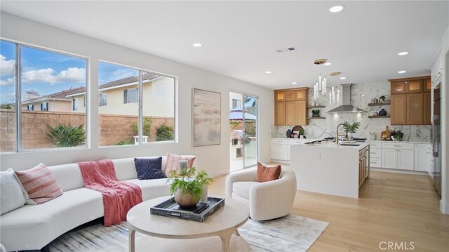 44 Statehouse Pl, Irvine, CA 92602 - living room featuring visible vents, recessed lighting, and light wood finished floors