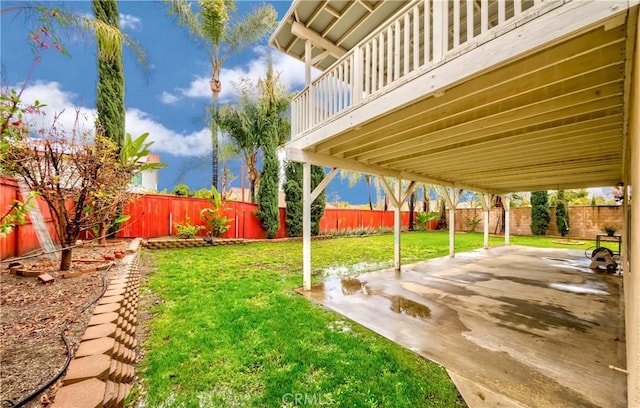 view of yard with a patio area and a fenced backyard