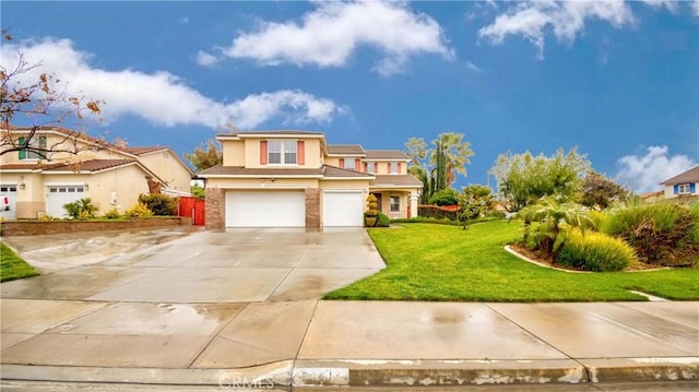 traditional-style house featuring stucco siding, an attached garage, a front lawn, and concrete driveway