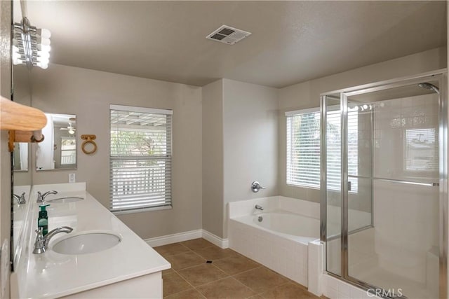 bathroom with a bath, a sink, visible vents, tile patterned flooring, and a shower stall