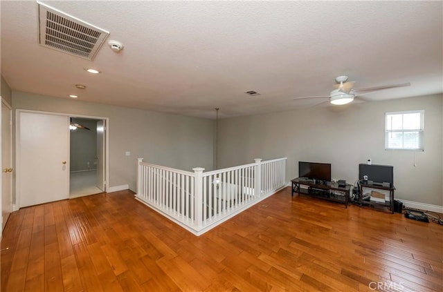 unfurnished room featuring wood finished floors, visible vents, recessed lighting, and ceiling fan