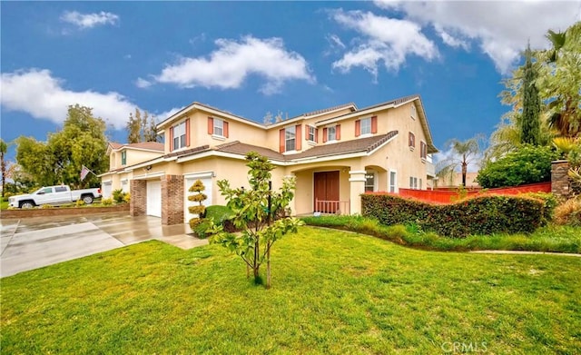 view of front of house featuring concrete driveway, a front lawn, stucco siding, and a garage