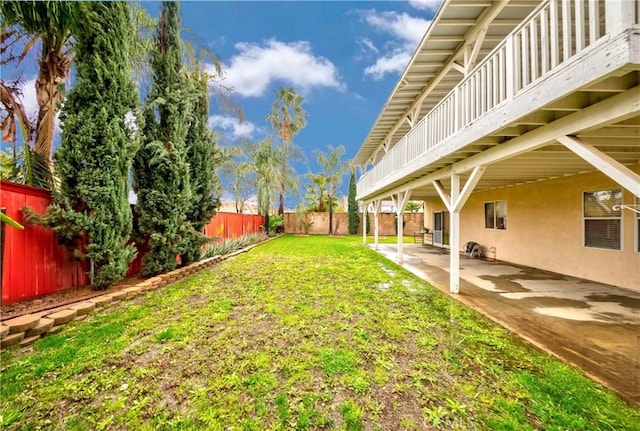 view of yard with a patio area and a fenced backyard