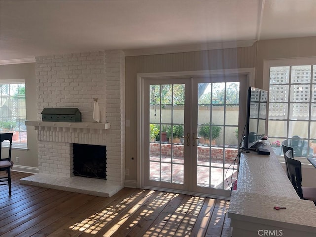 22191 Apache Dr, Lake Forest, CA 92630 - doorway featuring wood-type flooring, baseboards, a brick fireplace, and a wealth of natural light