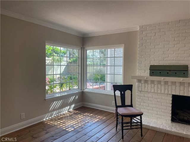22191 Apache Dr, Lake Forest, CA 92630 - sitting room featuring wood-type flooring, ornamental molding, baseboards, and a brick fireplace
