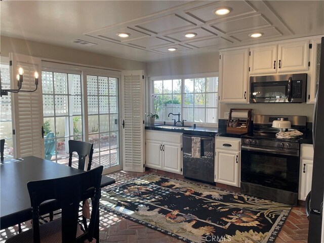 22191 Apache Dr, Lake Forest, CA 92630 - kitchen with dark countertops, a sink, brick floor, stainless steel appliances, and recessed lighting