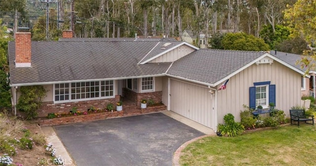 322 Calle De Arboles, Redondo Beach, CA 90277 - view of front of house with a chimney, board and batten siding, asphalt driveway, and brick siding