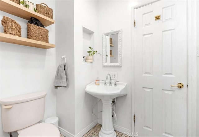 322 Calle De Arboles, Redondo Beach, CA 90277 - half bathroom featuring baseboards, toilet, and a sink