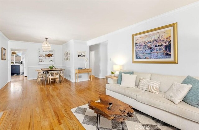 322 Calle De Arboles, Redondo Beach, CA 90277 - living area with light wood-style floors, crown molding, and baseboards