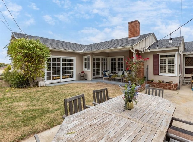 322 Calle De Arboles, Redondo Beach, CA 90277 - rear view of property with outdoor dining space, a patio, a chimney, and a lawn