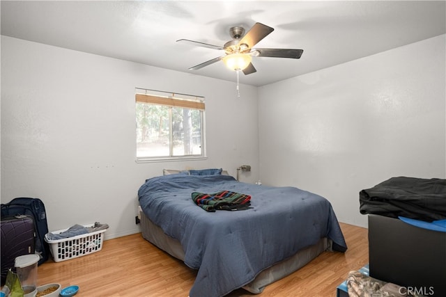 bedroom featuring ceiling fan and wood finished floors