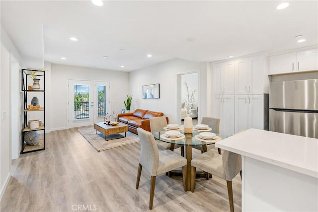 dining area featuring light wood finished floors, french doors, baseboards, and recessed lighting