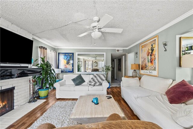 13 Lighthouse Street 13 & 15, Marina Del Rey, CA 90292 - living room with a ceiling fan, wood finished floors, a fireplace, crown molding, and a textured ceiling