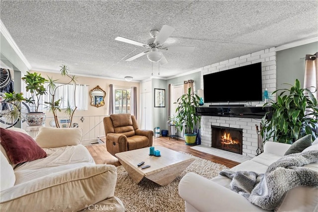 13 Lighthouse Street 13 & 15, Marina Del Rey, CA 90292 - living area featuring crown molding, wood finished floors, a ceiling fan, a brick fireplace, and a textured ceiling
