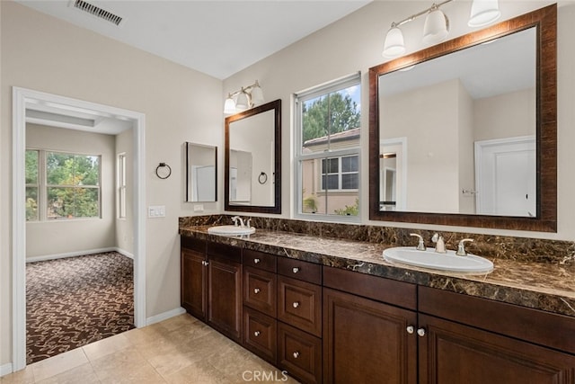 21 Deergrass, Irvine, CA 92618 - full bathroom featuring double vanity, baseboards, and tile patterned flooring