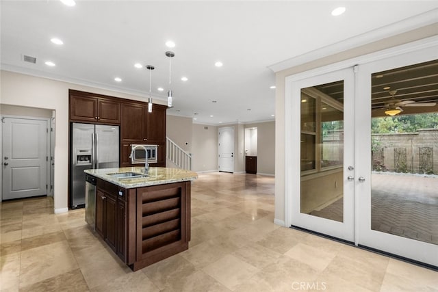 21 Deergrass, Irvine, CA 92618 - kitchen featuring stainless steel appliances, a sink, dark brown cabinetry, an island with sink, and recessed lighting