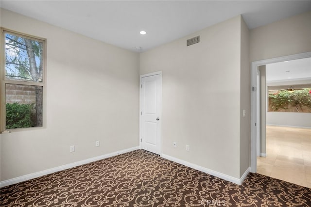 21 Deergrass, Irvine, CA 92618 - unfurnished room with healthy amount of natural light, recessed lighting, baseboards, and carpet