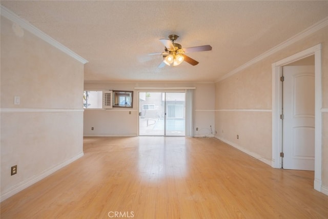spare room with baseboards, a ceiling fan, crown molding, and light wood-style floors