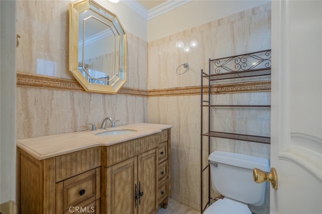 bathroom featuring crown molding, tile walls, toilet, and vanity